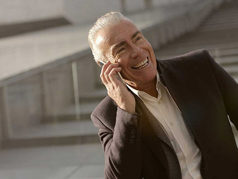 smiling man on cellphone