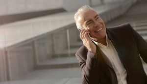 smiling man on cellphone