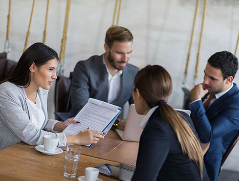 workers sitting around a table