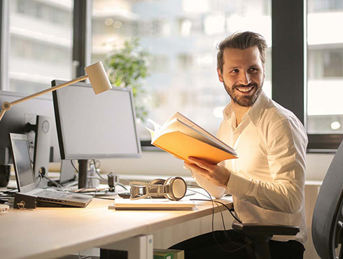 man with notebook in office