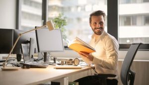 man with notebook in office