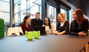 Workers sitting around a table