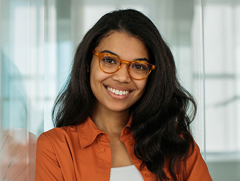 woman smiling with office in background