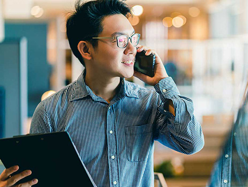 asian man on phone