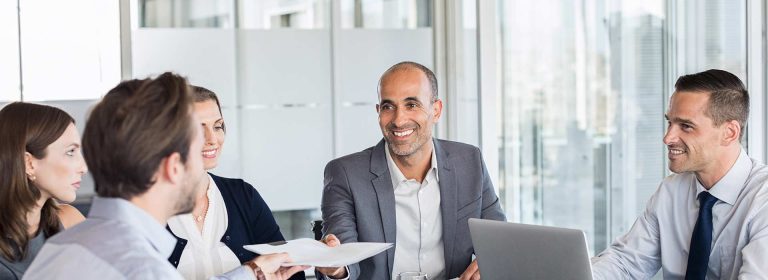 five team members in meeting