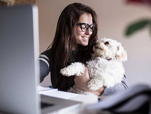 woman holding dog