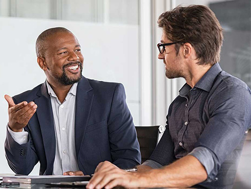 two team members talking