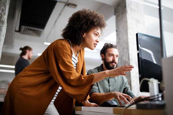 woman studying something on monitor