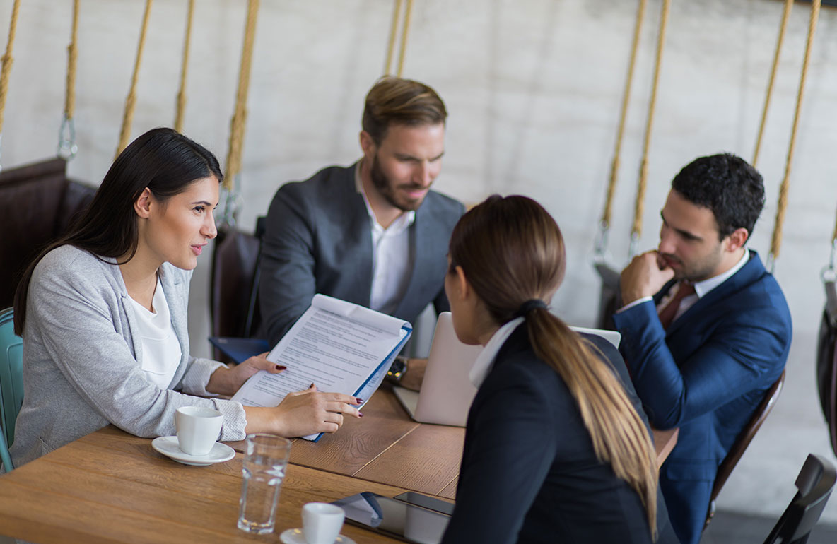 workers sitting around a table