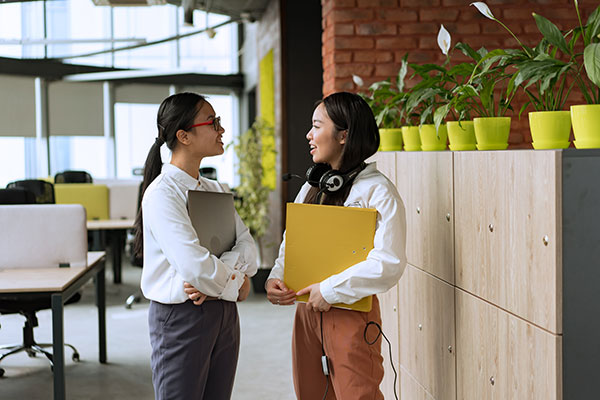 Two co-workers having a discussion