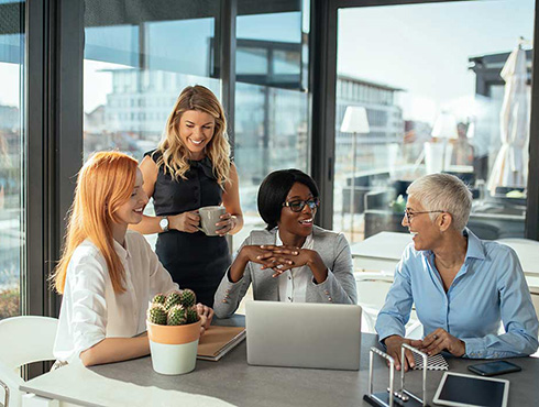 four people in an office