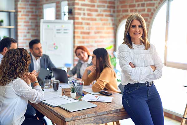 person leaning on table during a meeting