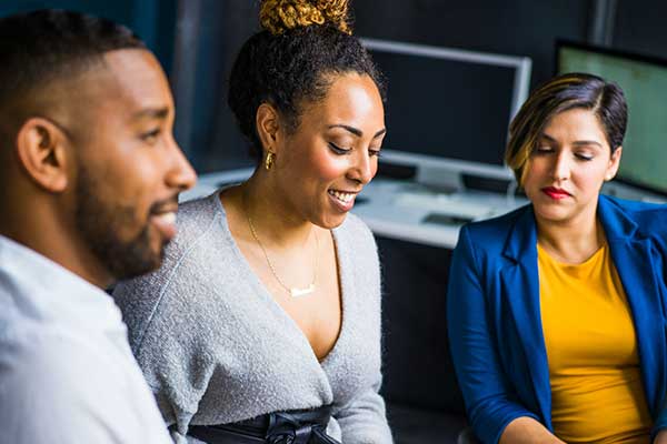 three diverse co-workers in meeting