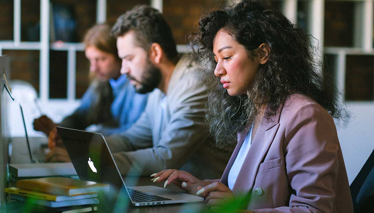 three team members working