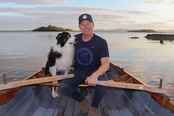 Conrad rowing with his dog.