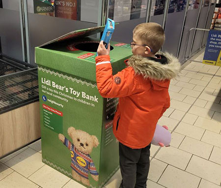 young boy dropping off gift