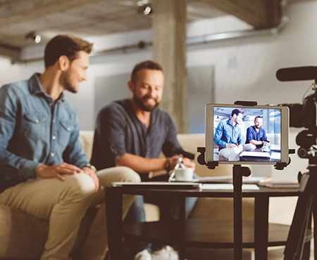 two men creating a video