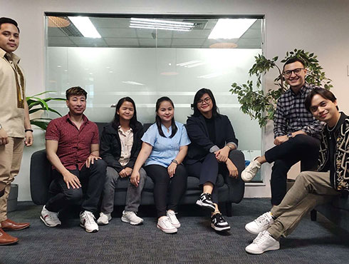 group of people sitting and standing in a room