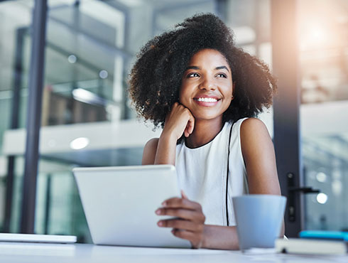 smiling woman sitting in office