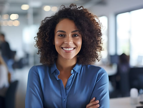 woman with blue shirt smiling