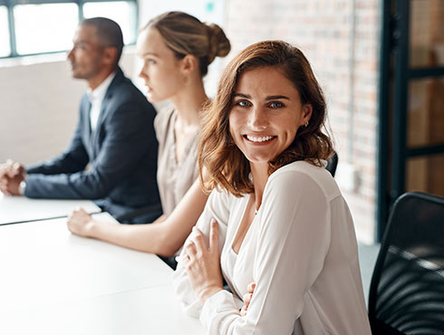 three people sitting at a table